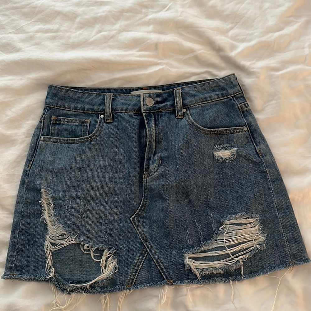 Distressed denim mini skirt